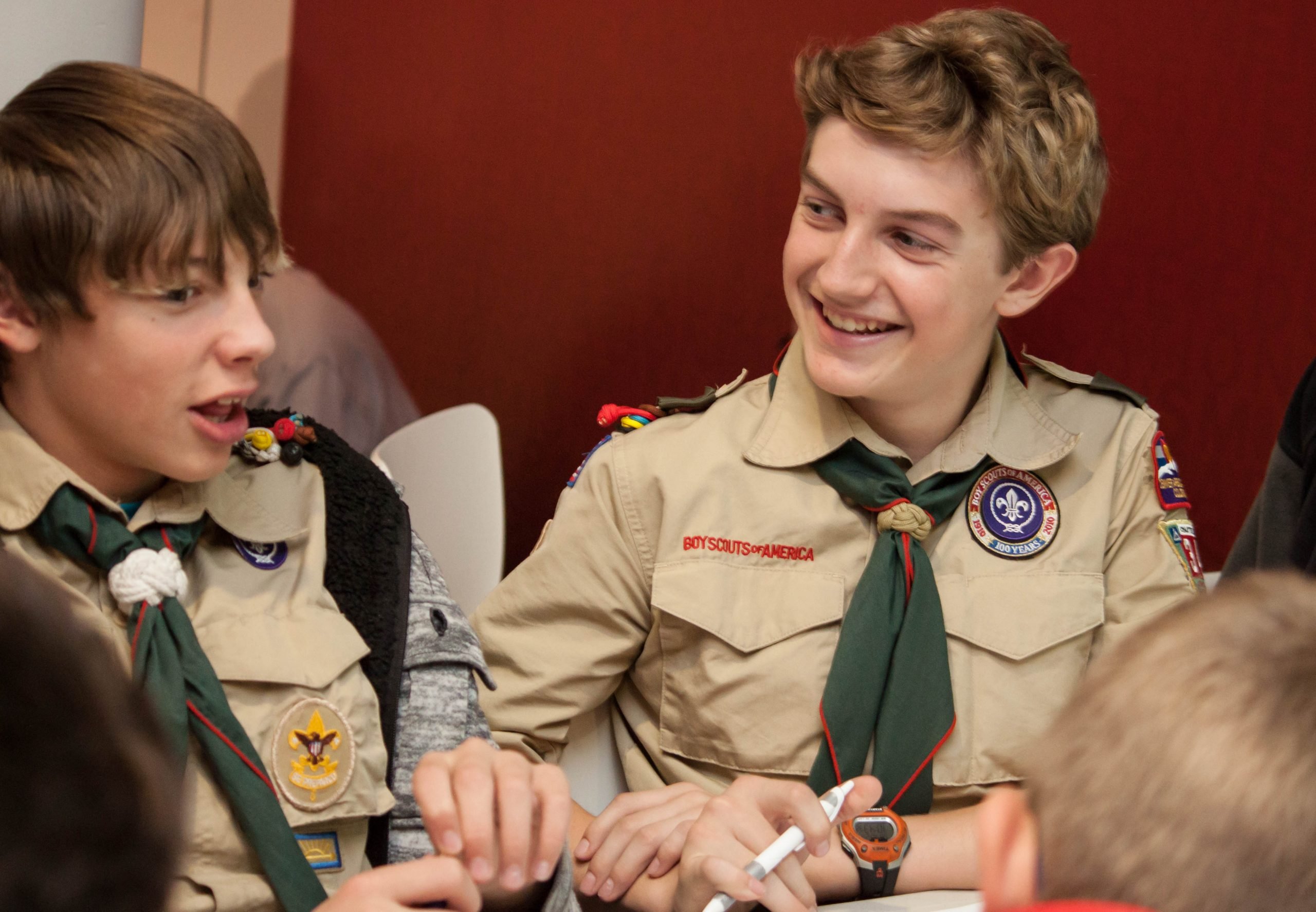 boy scouts smiling while in a learning session at the CELL