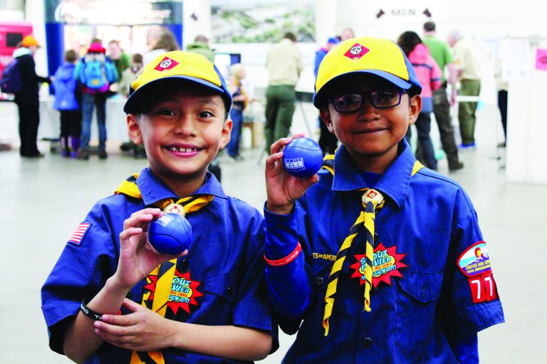 cub scouts holding CELL promotional items