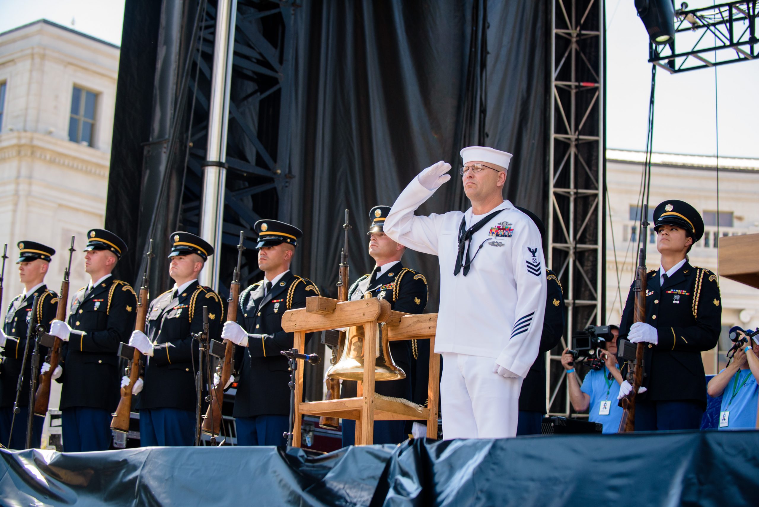 Naval officer saluting on stage