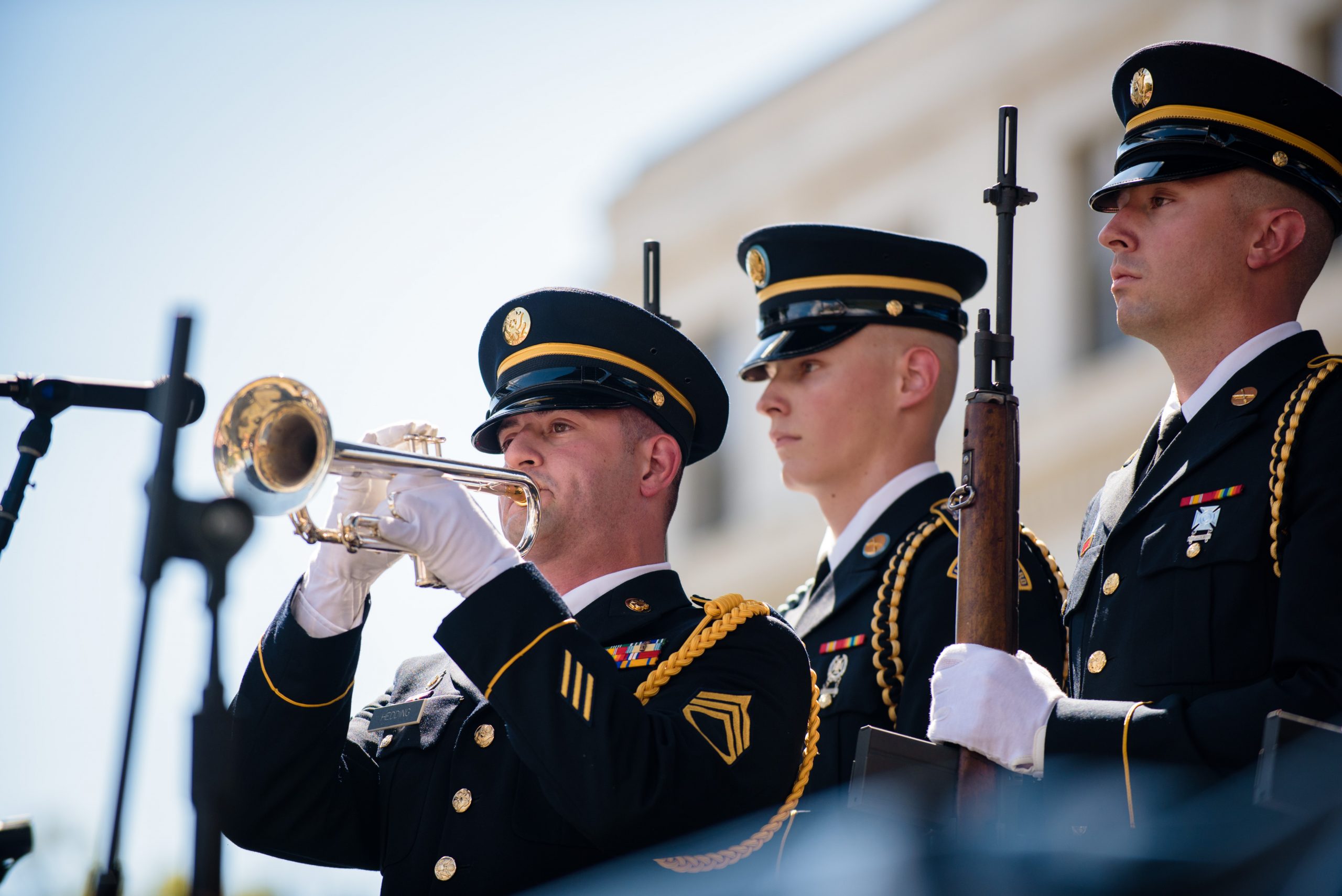 a solider playing a bugle